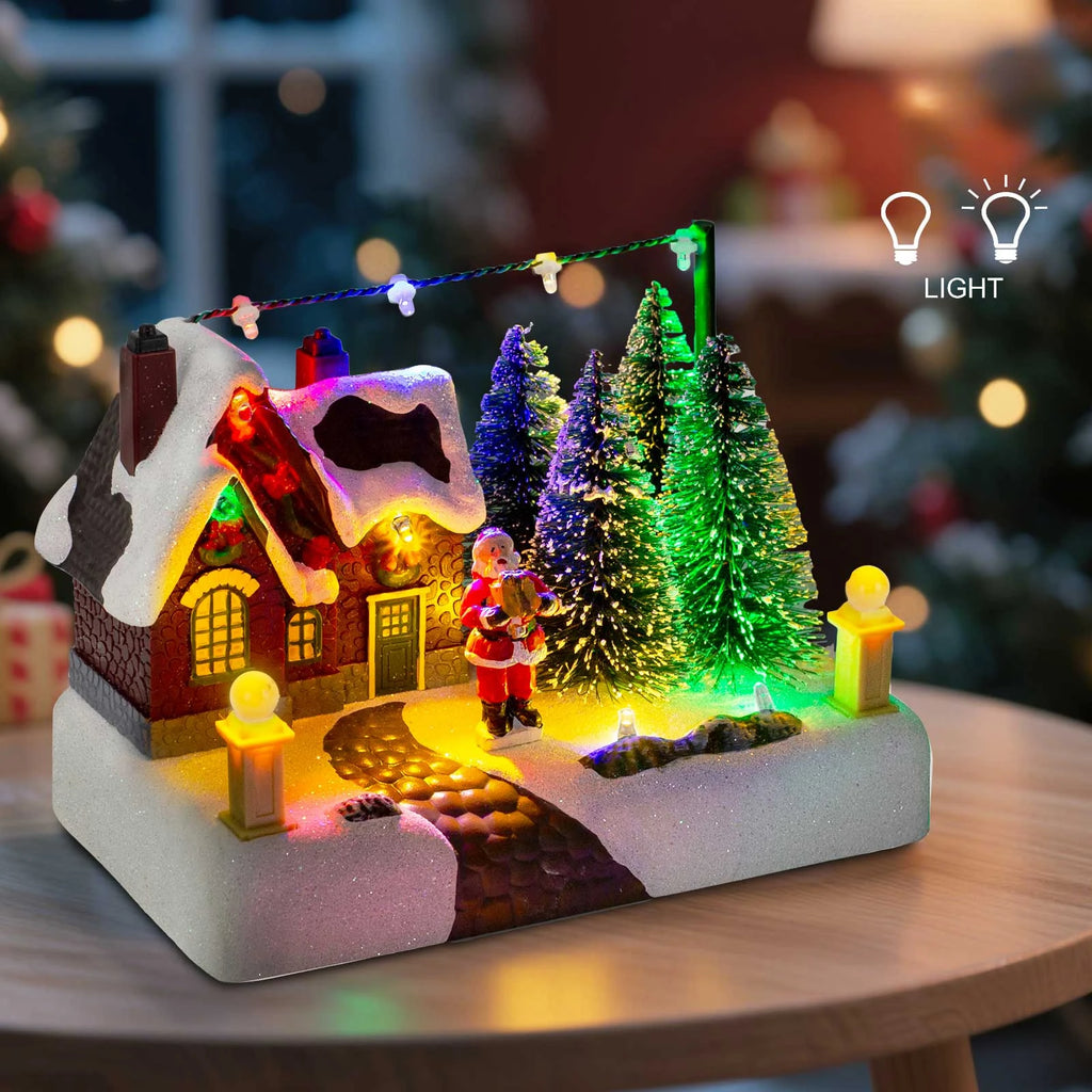 Pueblo navideño iluminado con Papá Noel y árboles