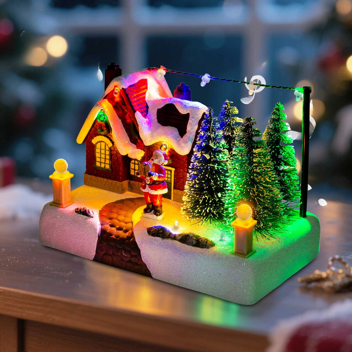 Pueblo navideño iluminado con Papá Noel y árboles